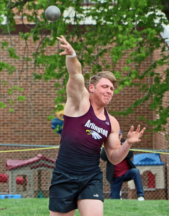 Arlington's Jacob Beans competes in the shot put Thursday at AHS. The Eagle medaled during his squad's home meet.