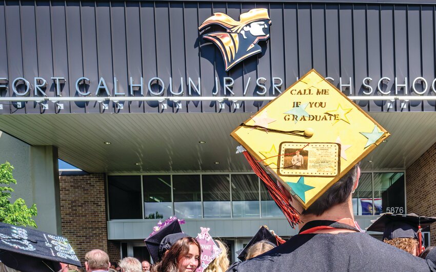 Fort Calhoun High School graduates gather following commencement Saturday afternoon.