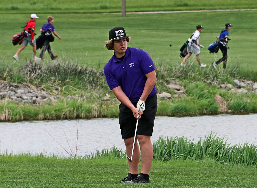 Blair's Jase Lantry watches a chip shot Monday during the Bears' nine holes at Indian Creek in Elkhorn.