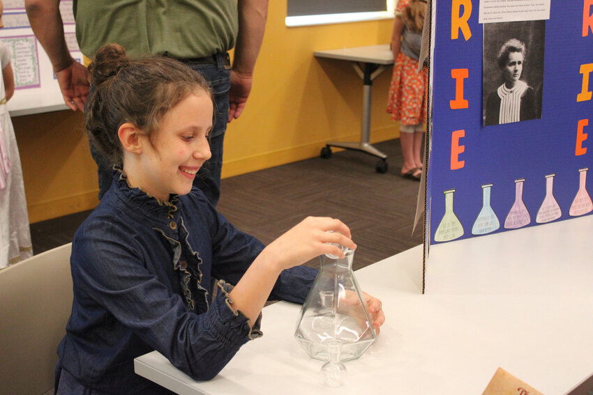 Harley Scott plays Marie Curie and presents facts about her chosen historical figure Friday at the Blair Public Library and Technology Center.