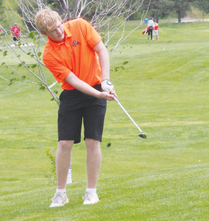 Nolan Magnusson makes an approach shot in the .EHC Invite..