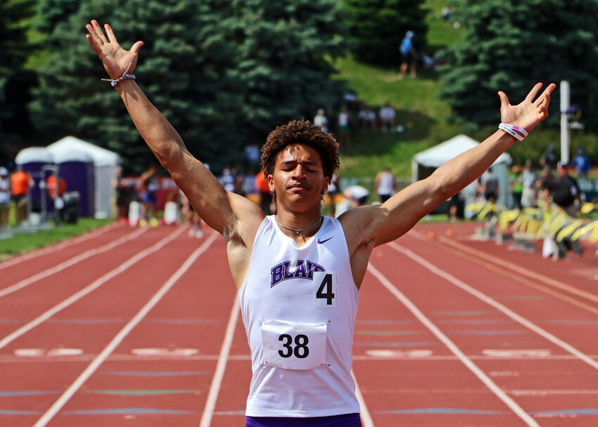 Blair High School sprinter Ethan Baessler celebrates a 100-meter dash title Thursday during the NSAA Class B State Track and Field Championships at Omaha Burke Stadium. The senior also won the 200 dash.