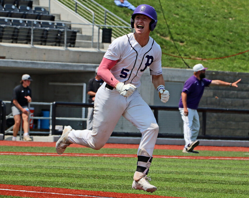 Blair senior Nate Wachter celebrates an RBI swing on his way to first base Tuesday at Tal Anderson Field in Omaha. The Bears knocked off the second-seeded Elkhorn North Wolves, 9-8, during NSAA Class B State Championships play.