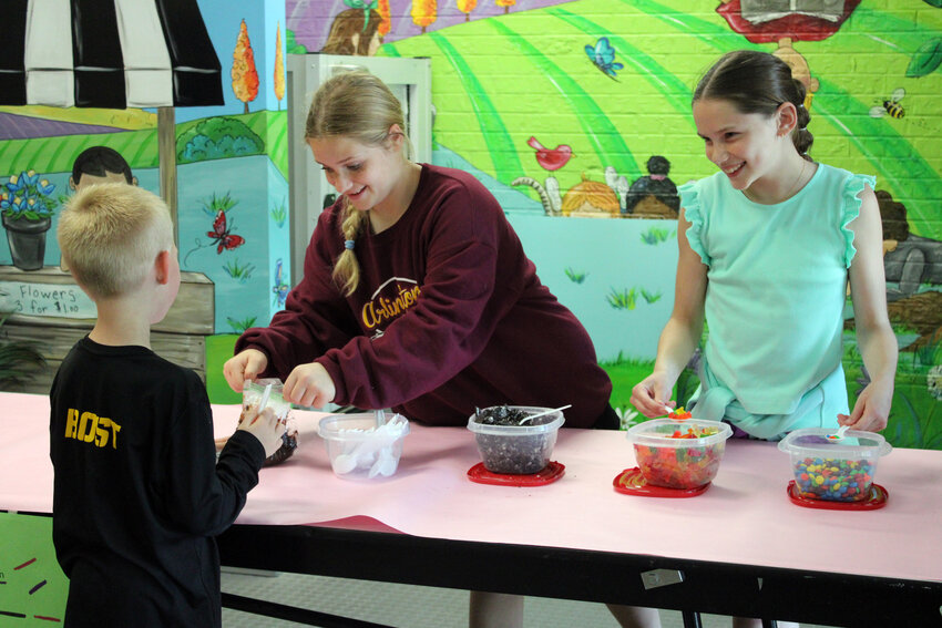 Sixth-graders at Arlington Elementary ran different businesses during the week, selling and making sweet treats to their peers near the front office.
