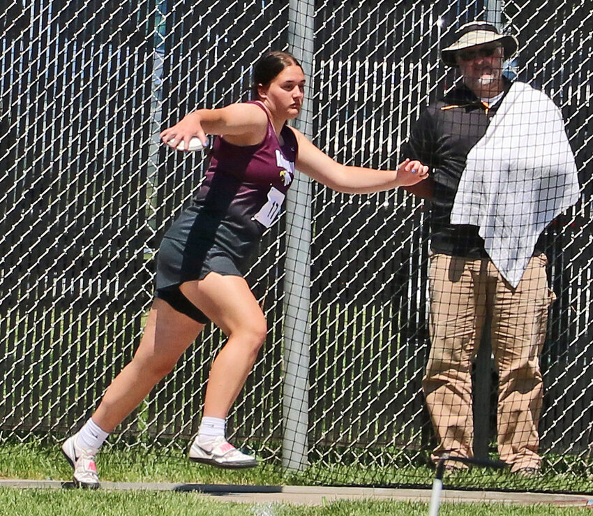 Arlington freshman Hayley Arp warms up for the discus throw Friday at Omaha Burke Stadium.
