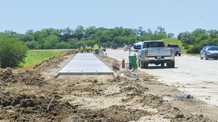 Construction workers are building a bike path along the soon-to-be-opened south bypass in Blair.