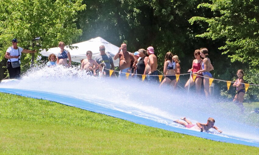 A line forms for the Arlington Summer Sizzle waterslide Saturday afternoon.