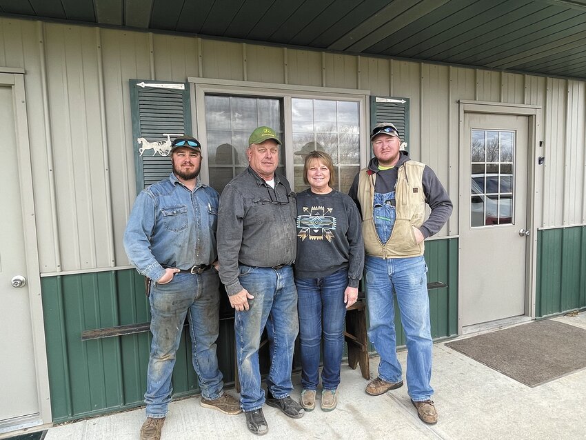 The Kubie family are third-generation Washington County farmers. Jason and Kelly are shown between their sons, Garet on the left and Grant to the right.