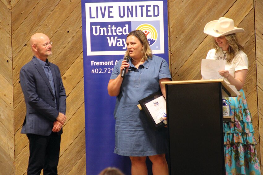 Cindy Slykhuis, center, vice president of marketing for RVR Bank, received the literacy award during the Fremont Area United Way's 13th annual Hats Off To Literacy last year, held at the Washington County Fairgrounds. Pictured with Slykhuis are Chuck Johannsen, president and CEO of RVR Bank, and Christy Fiala, executive director of Fremont Area United Way.