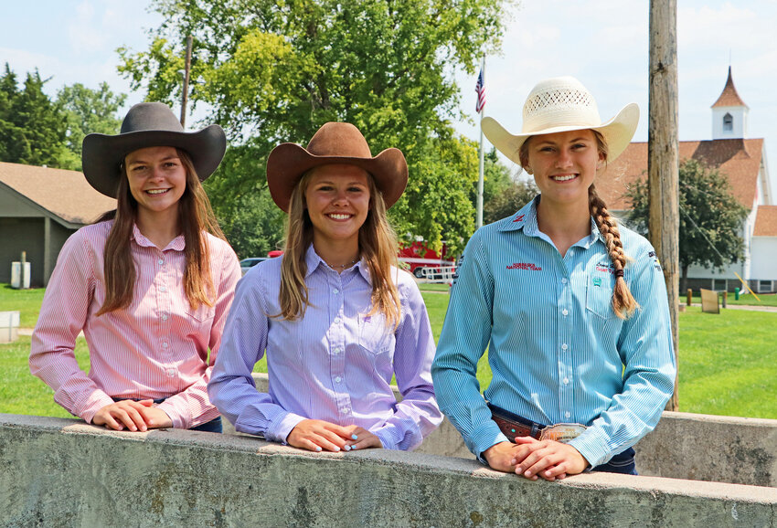 Cowgirls Hailey O'Daniel, from left, Erika Cruikshank and Laney Hoier pose for a photo July 10 in Kennard.