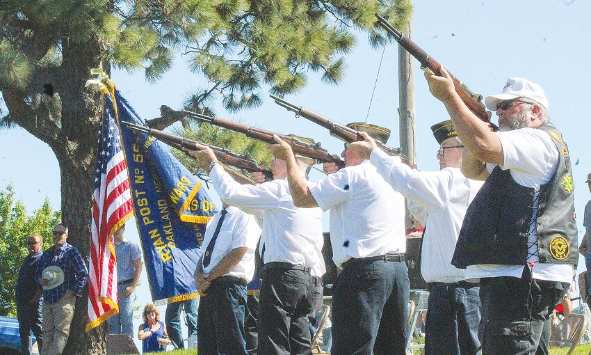 The Honor Guard offers a gun salute at the conclusion of the 2024 Memorial Day service in the Oakland Cemetery.