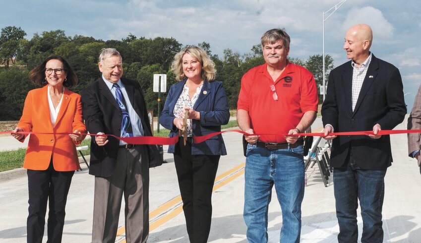 From left, U.S. Sen. Deb Fischer, former Blair Mayor Jim Realph, Mayor Mindy Rump, former director of public works Allen Shoemaker, and U.S. Sen. Pete Ricketts take part in the Hollow Road Bypass ribbon-cutting event Thursday.