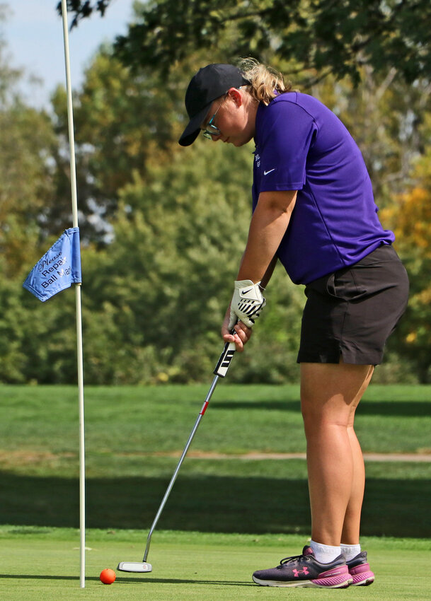 Tessa Nicholson of Blair putts Monday at River Wilds Golf Club.