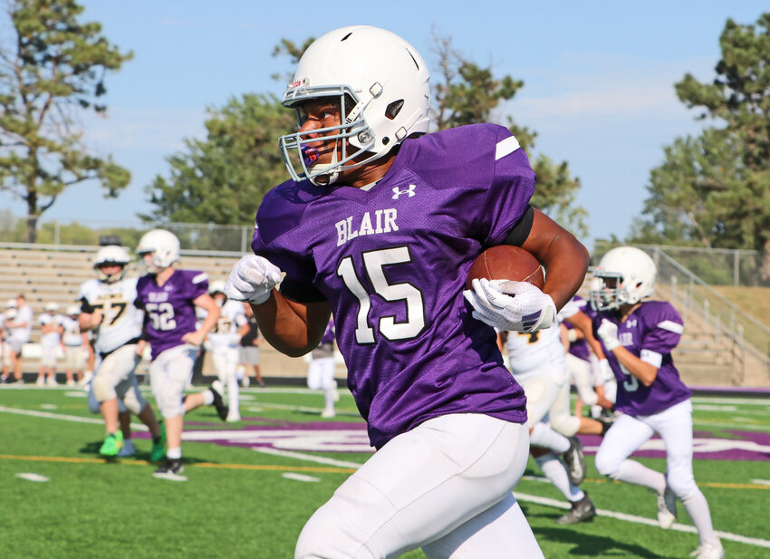 Otte Blair Middle School seventh-grader Kavion Almond carries the ball for a long touchdown run Tuesday at Krantz Field. The Bears hosted Gretna Aspen Creek Middle School.