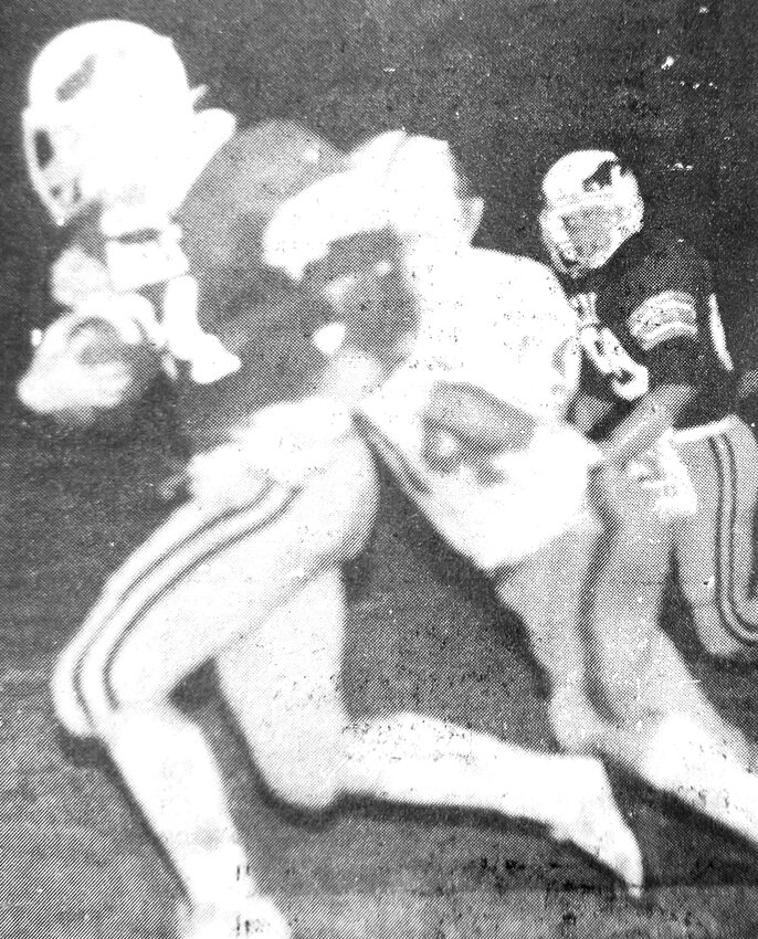 Eagle Shawn Fuhrer, left, carries the ball during Arlington High School's 1983 homecoming game.