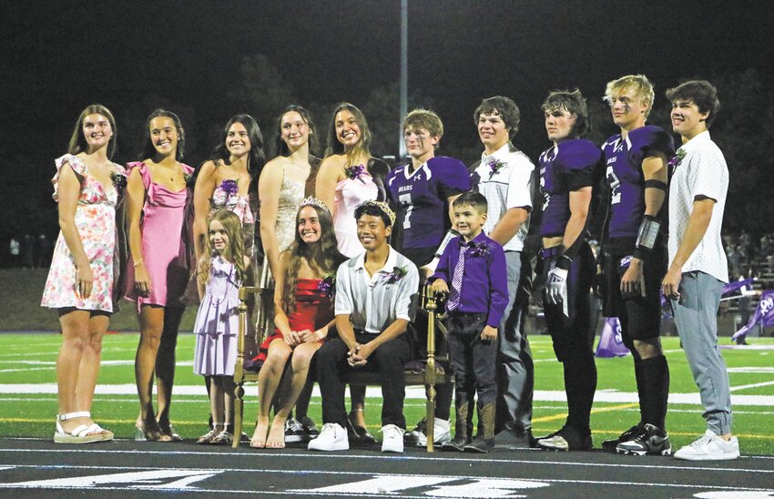 Blair Bear mascot and cheerleaders greet students along the homecoming parade route Friday afternoon.