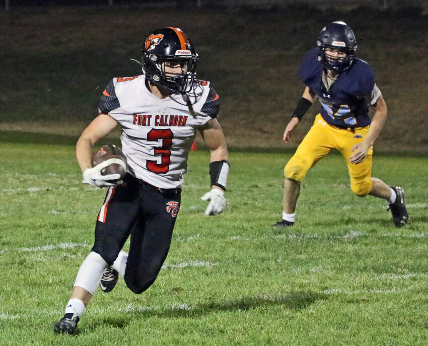 Fort Calhoun senior Levi Lasher carries the ball upfield Friday during a 41-17 victory at Omaha Concordia.