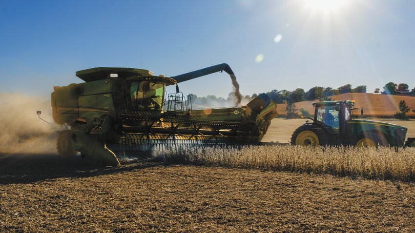 Dust and dirt billow as Jarett and Tim Andersen recently harvest soybeans east of Kennard.