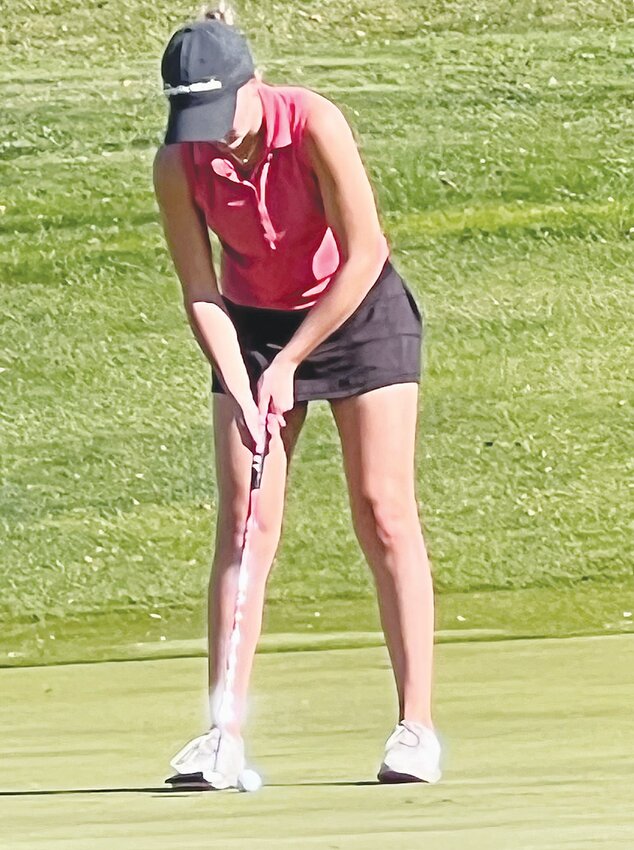 Congratulations to Emma Anderson in qualifying for State.  Here she lines up a putt at district competition..