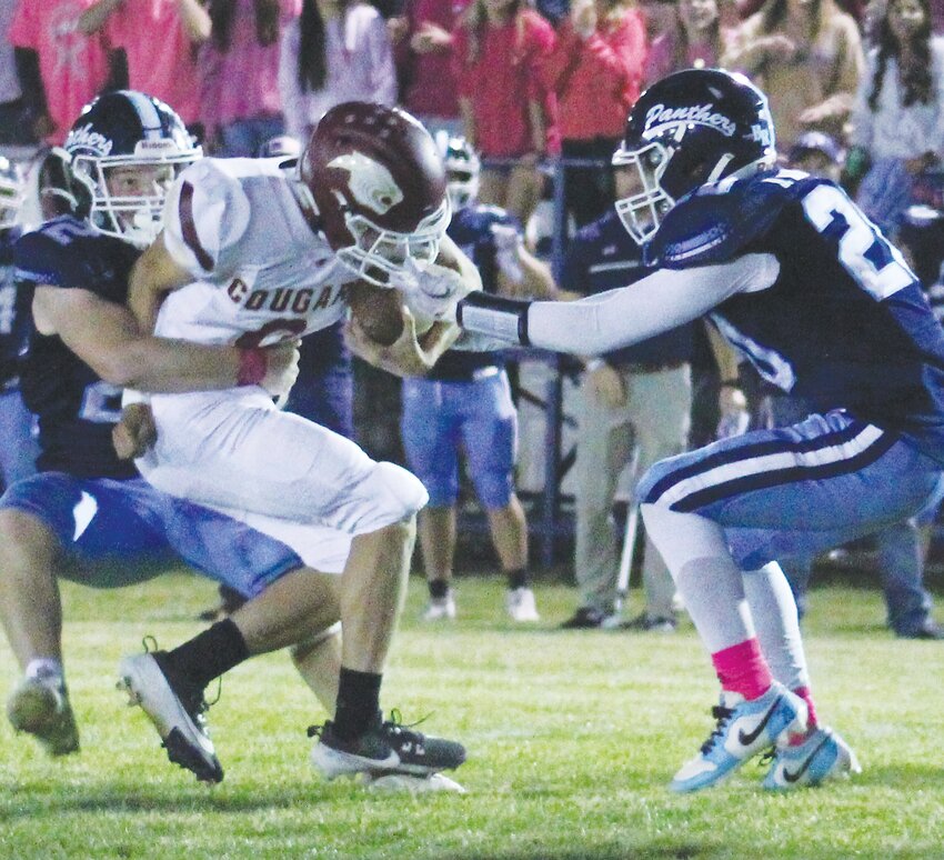 Masen Olsen fights for the yardage.