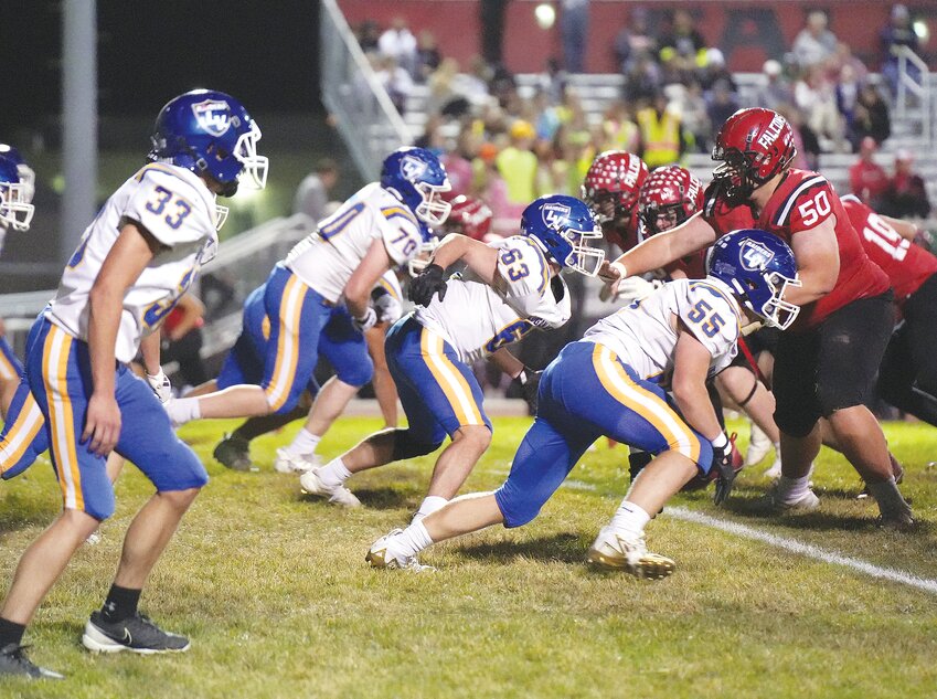 The LVSS defense goes to work on the Falcons.  #70 Chase Hartman, #63 Dawson Klug, #55 Chaise Hilbers, #33 Chris Roeber and #1 Ryan Smith move on the snap to get a stop against DC West.