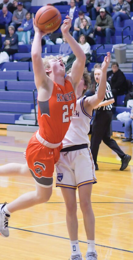 Nolan Magnusson goes up for a contested layup against LVSS.