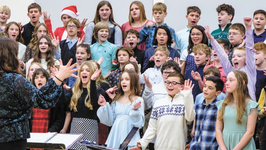Fifth- and sixth-graders at Fort Calhoun Elementary sing &quot;We Wish You a Swingin' Holiday&quot; during their recent winter concert.