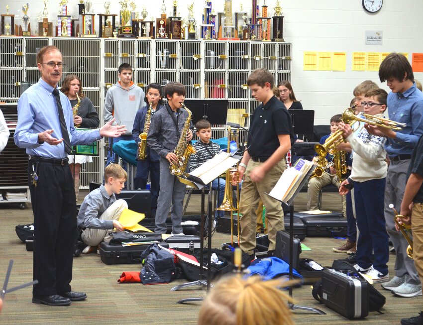 Fort Calhoun Community Schools Director of Bands Mark Jones gives pre-concert instructions to his fifth and sixth graders before their winter concert.
