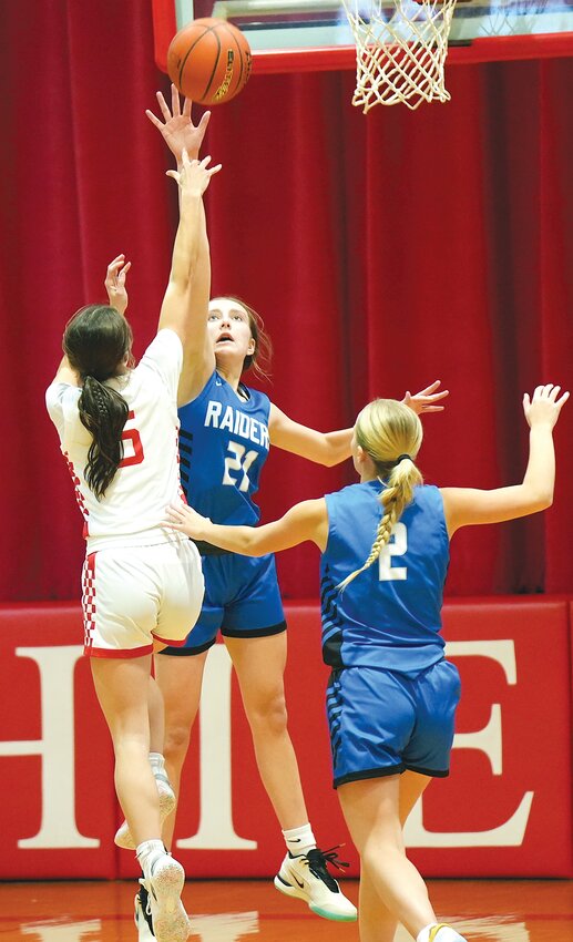 Jayde Kreifels #21 plays tough defense under the hoop rejecting the Yutan shot. Jayde scored 2 points, grabbed 13 rebounds, had 2 assists and steals and 5 blocked shots against the Chieftains.