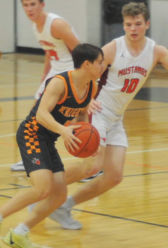 Sylas Nelson drives for two of his four points in Stanton.