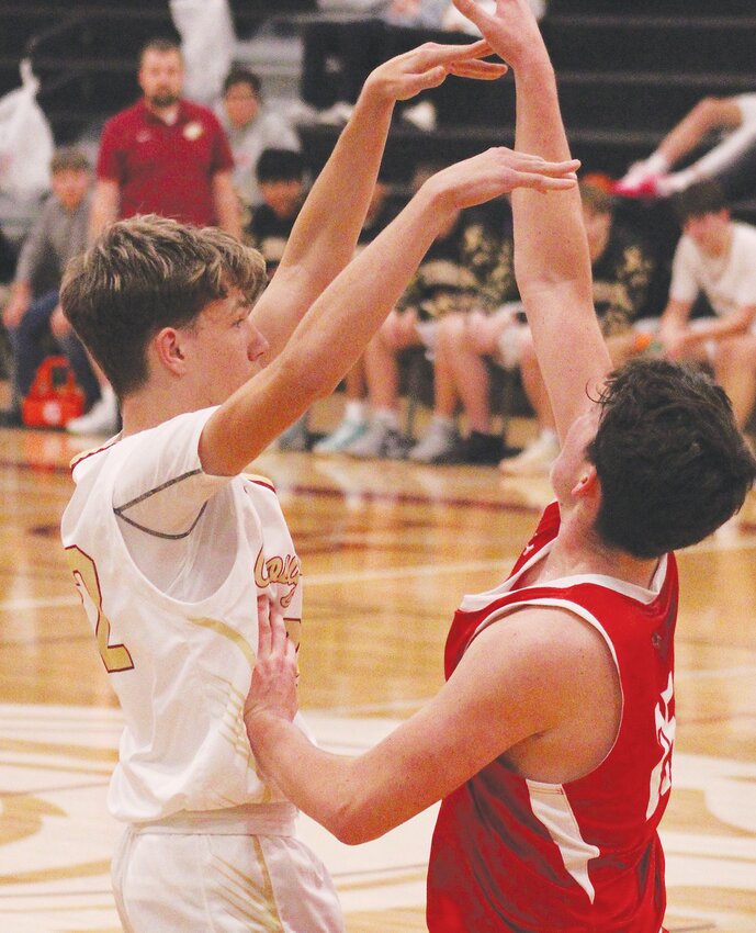 Weston Hardeman passes the ball against the Pender defender.