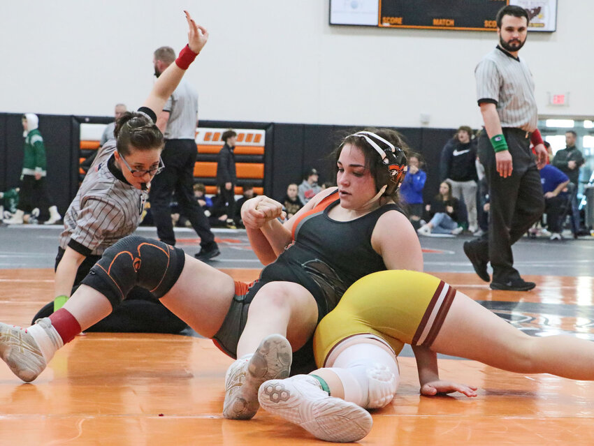 Pioneers 145-pounder Beckah Gossman, left, scores Saturday during Nebraska Capitol Conference Tournament at Fort Calhoun High School &mdash; even with her back to her opponent.