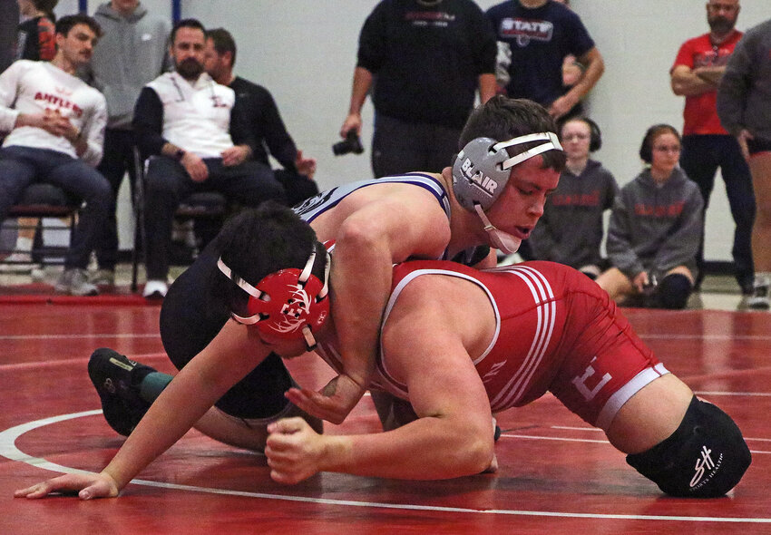 Blair wrestler Blaise Baughman, top, competes against an Antler on Saturday during the Eastern Midlands Conference Tournament at Elkhorn High School.