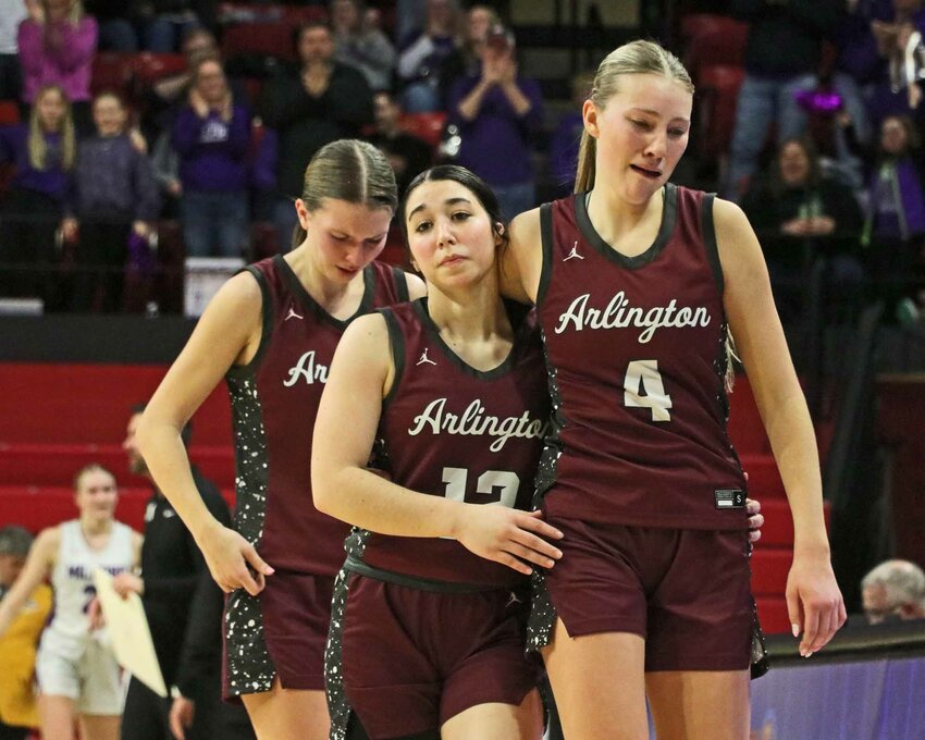Arlington Eagles Libby Hegemann, middle, Macy Wolf, right, and Britt Nielsen leave the floor March 5 after the Eagles' season-ending loss to Milford at the Bob Devaney Sports Center in Lincoln.