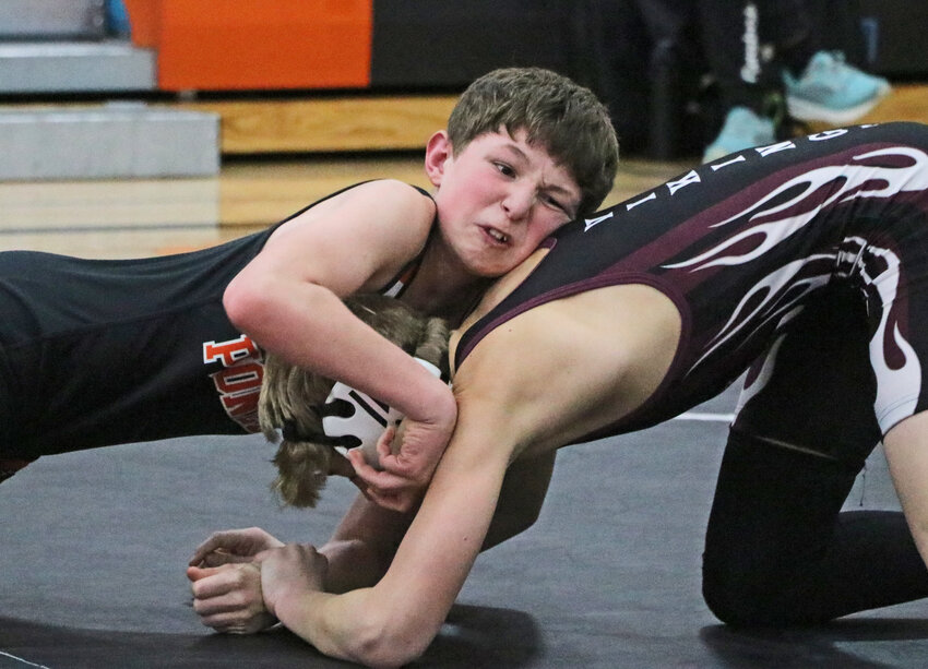 The Pioneers' Eli Stamm, left, wrestles Friday at Fort Calhoun High School. Calhoun hosted their annual 14-team tournament there with both Arlington and Otte Blair Middle School attending from within Washington County.