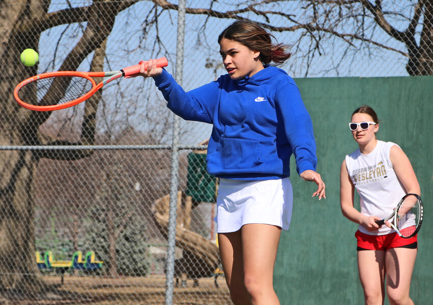 Makaela Opetaia-Swope, left, makes a play on the ball Thursday during Blair tennis practice as Josie Kros watches at Stemmermann Park.