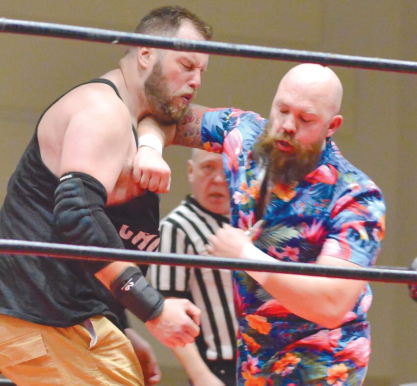 Vic Douglas (right) lays some hurt on Mac (left) in a recent Next Level Wrestling match in Fremont.