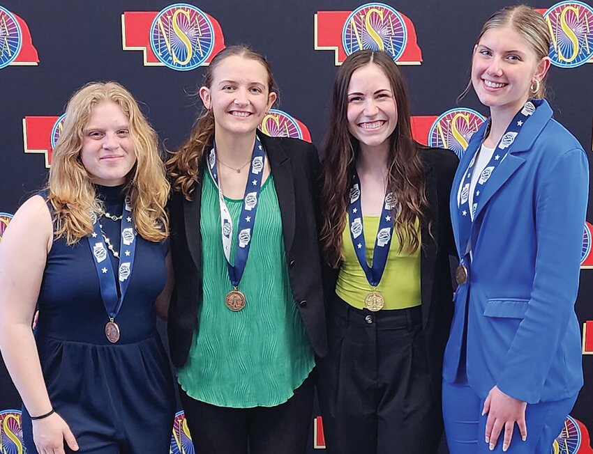 Brining home medals from the Nebraska State Speech Meet are, from left, Naomi Gahan - 5th Place Extemporaneous, Brooklyn Richards - 5th  Place Oral Interpretation of Poetry, Grace Wallerstedt - Champion in Entertainment , and Lily Peterseon - 3rd Place Program Oral Interpretation.