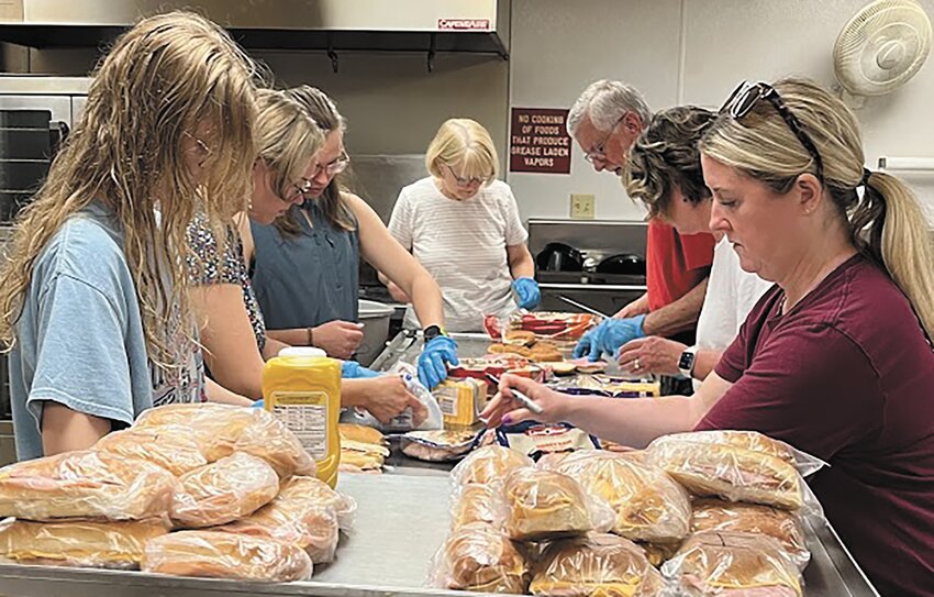 Sandwiches were assembled and delivered to workers in tornado-affected areas by volunteers from Blair's First Lutheran tornado recovery center.