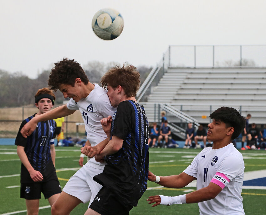 Blair juniors Lane Christensen, second from left, and Victor Hernandez, right, contend for a ball in the air Thursday against the Badgers at Bennington High School.