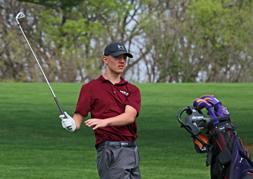 Arlington golfer Winston Slykhuis watches his shot down the sixth fairway Tuesday at River Wilds Golf Club.