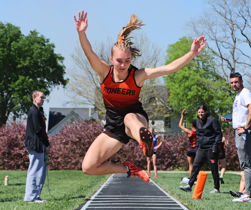 The Pioneers' Anna McMahon triple jumps Tuesday during the Fort Calhoun Invite.