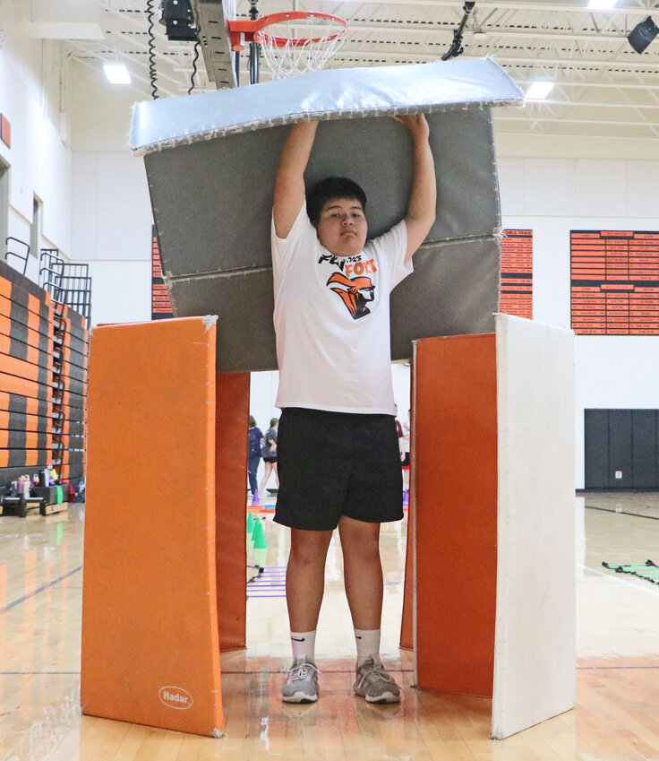 Noah Le demonstrates his strength Monday during the second annual Fun at The Fort event at Fort Calhoun High School.