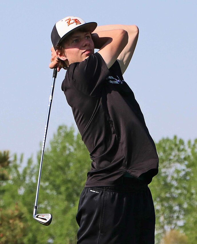 Fort Calhoun's Tysen Sunderman watches his approach shot Thursday during the Nebraska Capitol Conference Tournament at Country Drive Golf Course.