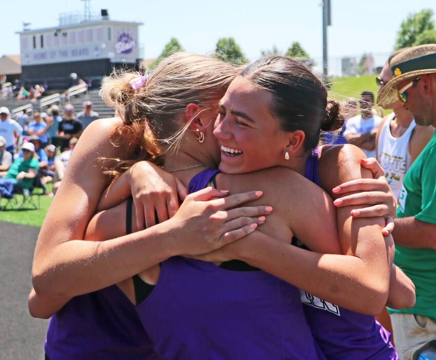 Blair senior Hailey Roewert, right, celebrates with London Larsen, middle, and Emma Ammon on Tuesday after all three Bears qualified for state in the high jump at Krantz Field. BHS hosted the Class B District 3 Meet.