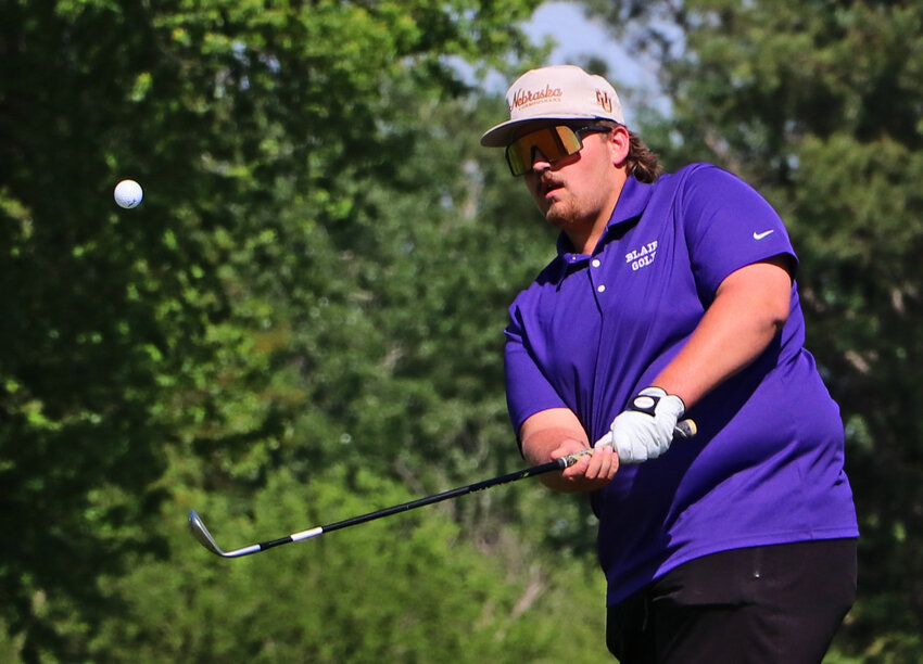 Blair golfer Tyson Leehy chips his ball onto the eighth green Monday at River Wilds Golf Club.