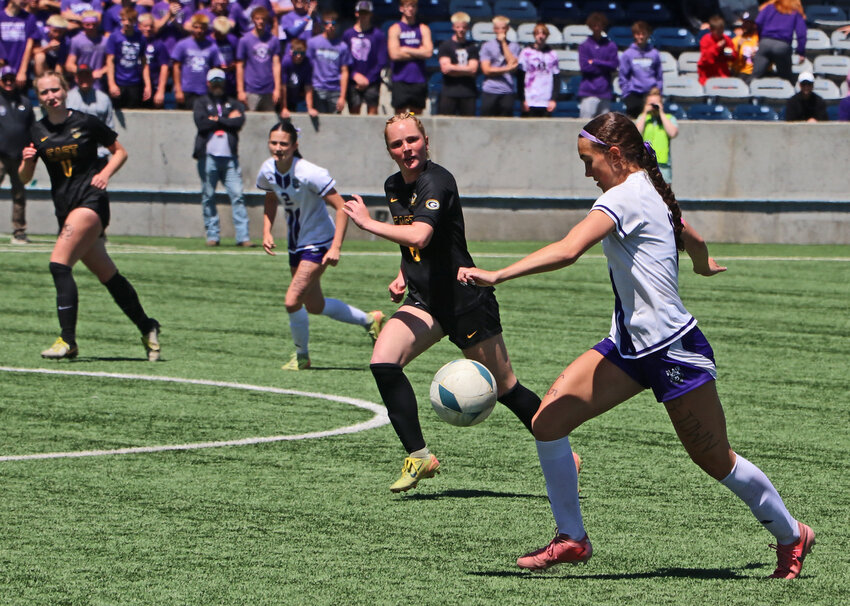 Blair senior Brynn Ray, right, moves upfield with the ball Saturday against Gretna East during the Class B state semifinals at Morrison Stadium in Omaha.