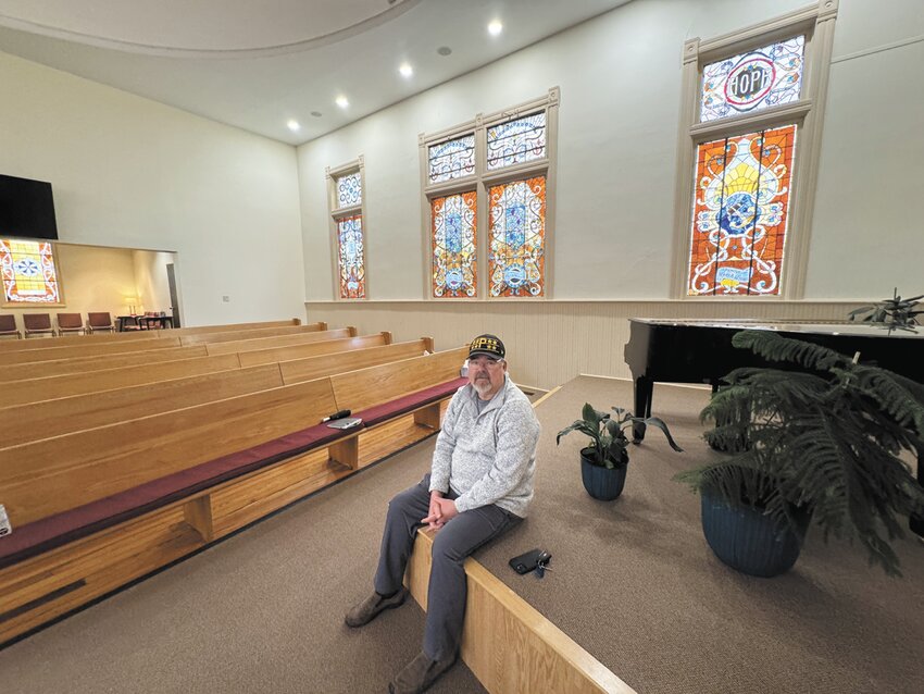 Jay Anderson, moderator at First Baptist Church in Blair, sits in the refinished sanctuary this week.