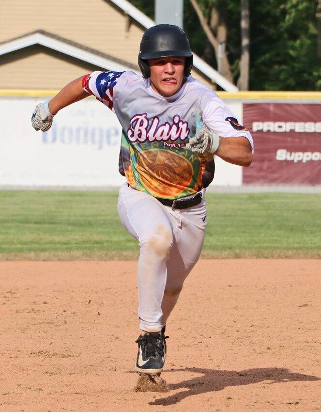 Blair Junior Legion base runner Landon Bernasek races from second to third base June 4 at Vets Field.