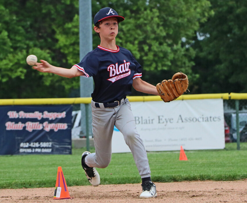 The Braves' Brock Whyrick, 12, throws toward home plate Thursday during a skils challenge on Blair Little League's All-Star Night at the Youth Sports Complex.